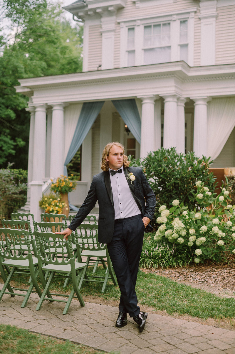Black tux, white columns — McAlister-Leftwich House
