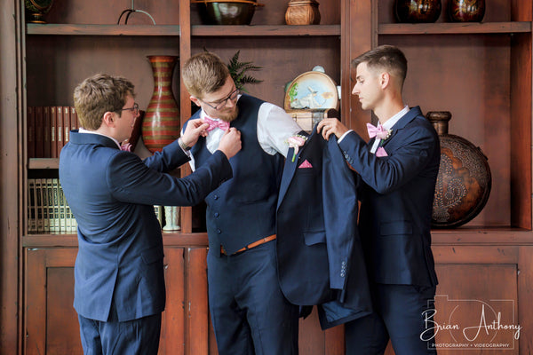 The groomsmen get him ready