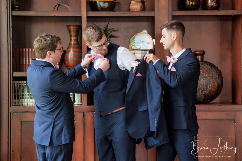 The groomsmen get him ready