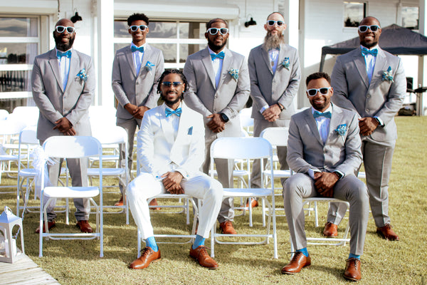 White for the groom, grey for the crew — waterfront vows