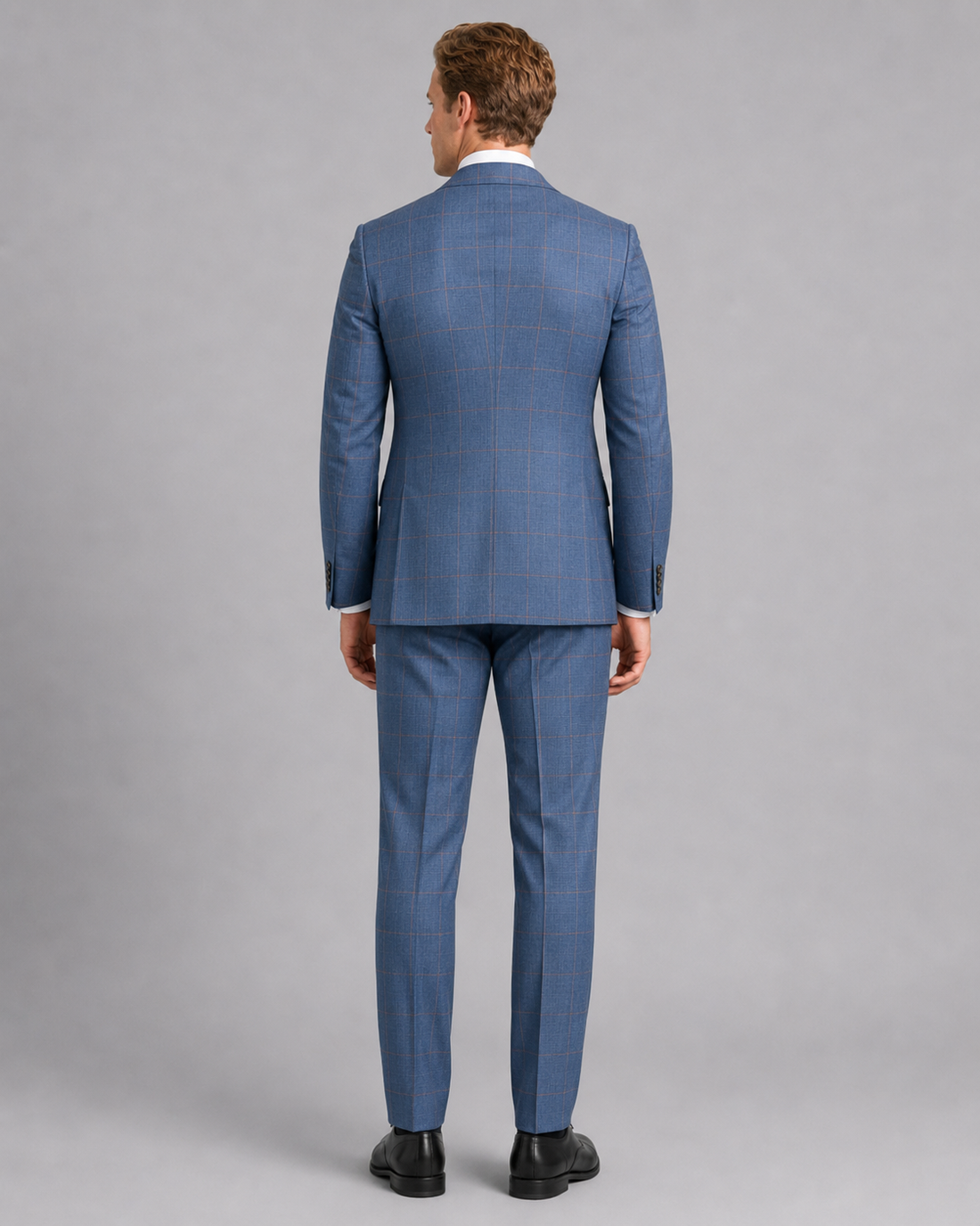 Back view of sky blue sharkskin modern tailored suit