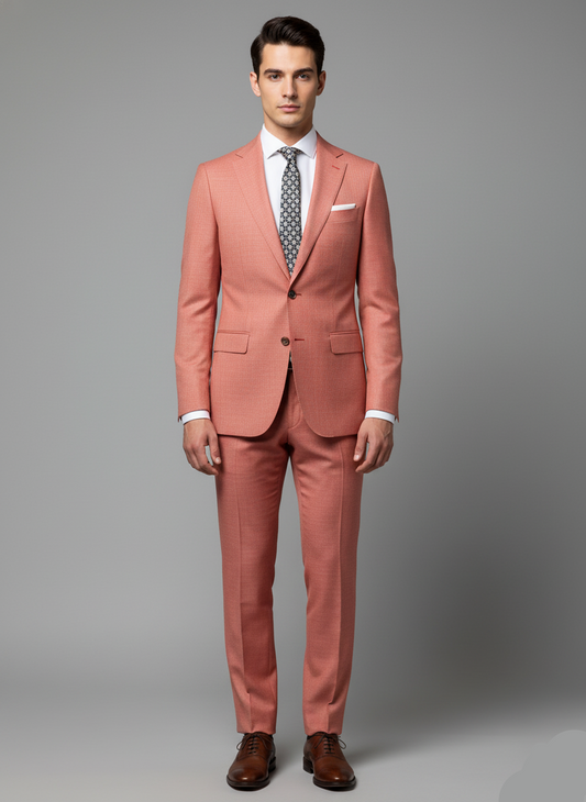 Man wearing a pink suit with a gray background