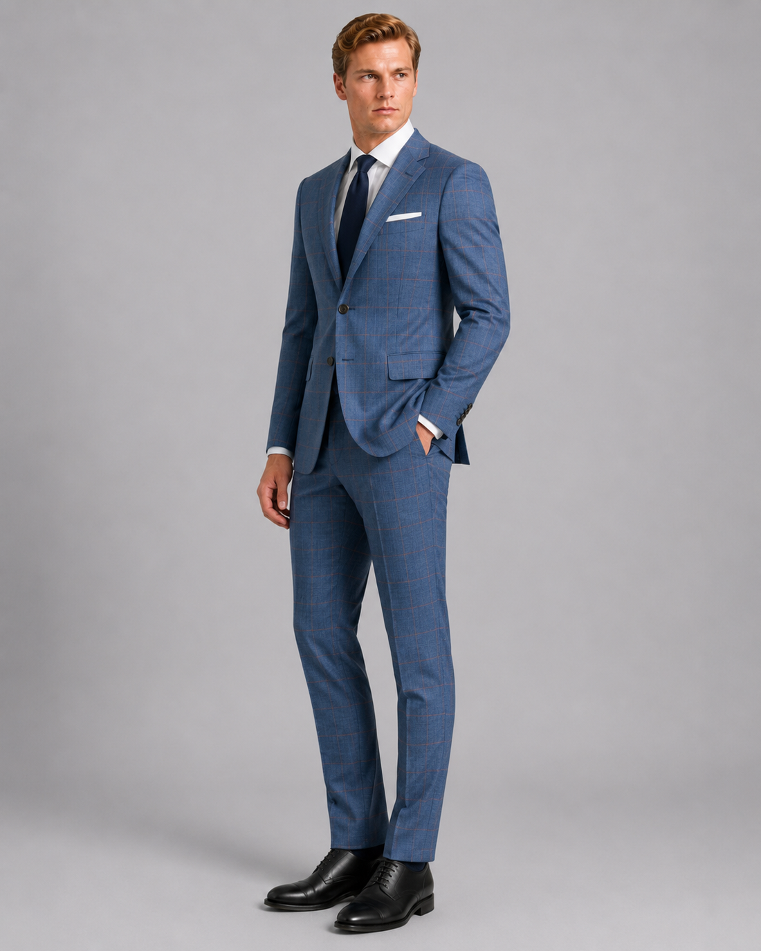 Side angle of luxury sky blue tailored sharkskin suit