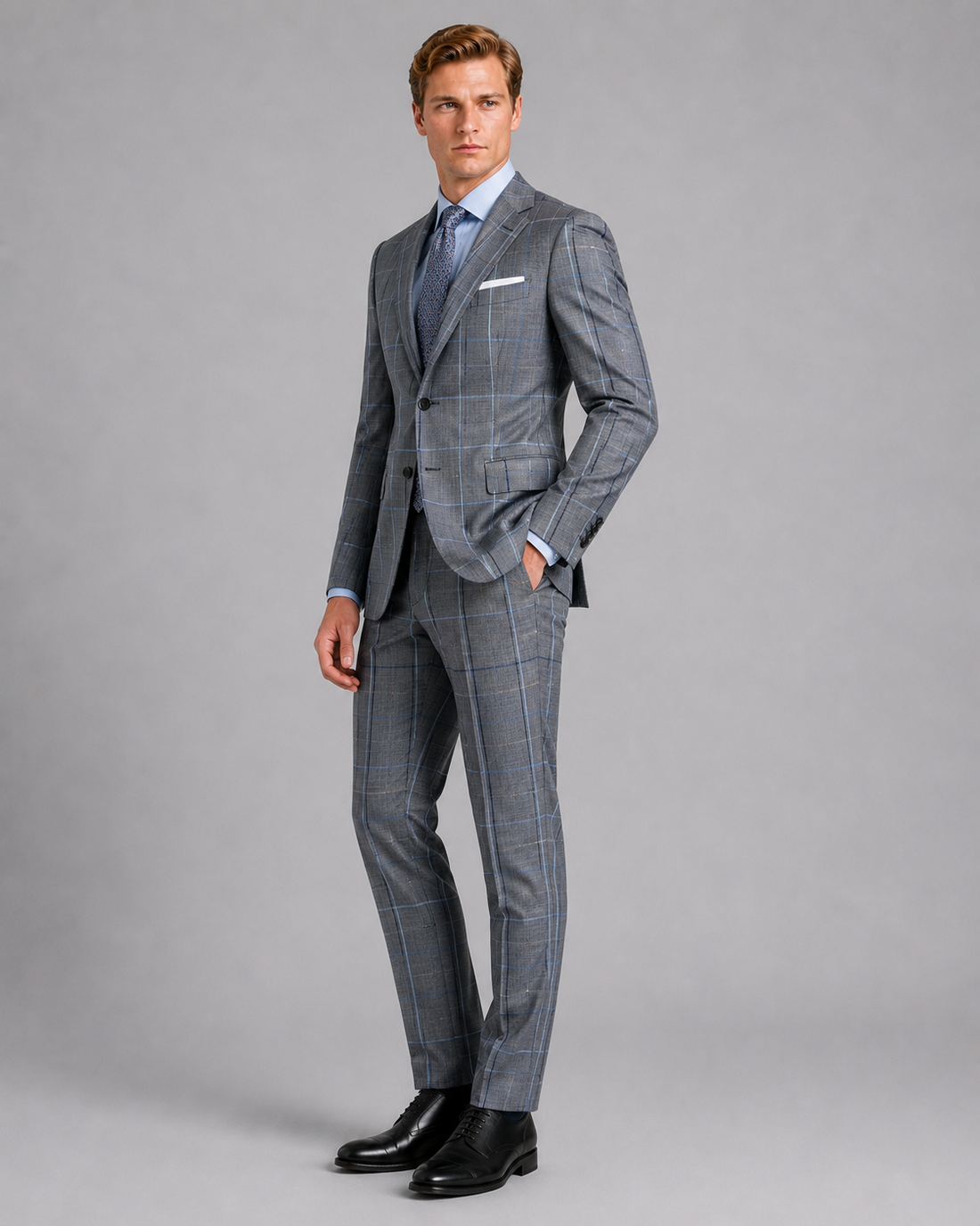 Side profile of charcoal gray sharkskin suit with blue windowpane checks