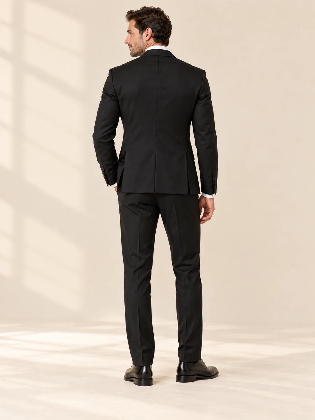 Black suit, back view showing jacket fit