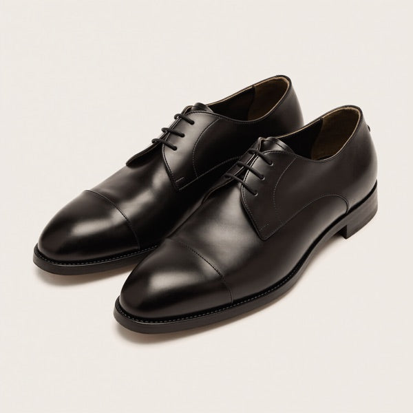 Black cap-toe oxford shoes