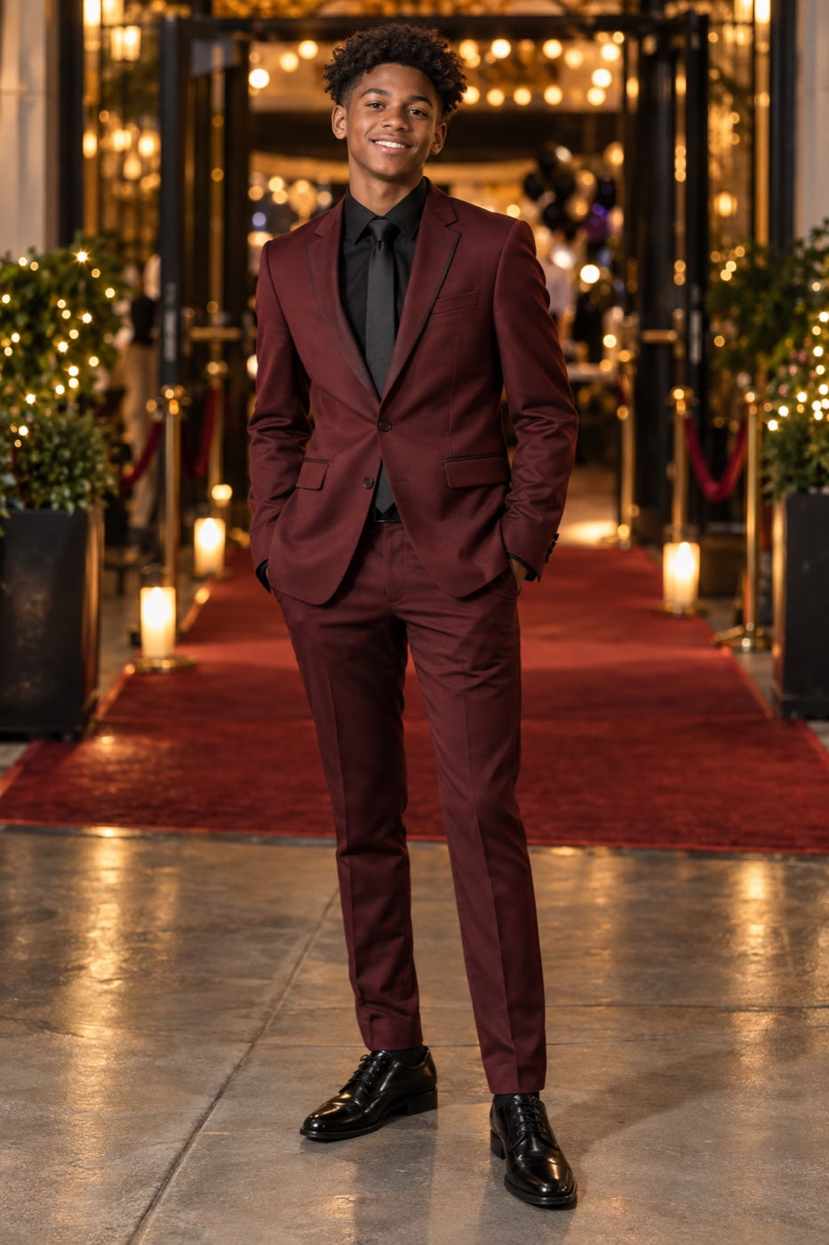 Teen in a burgundy suit on homecoming night